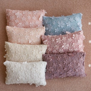 Newborn posing pillow — soft pastel shades, plush support, and essential prop for cozy, timeless baby photography