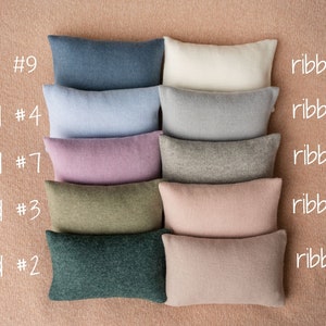 Soft newborn pillow prop – gentle posing support for photography