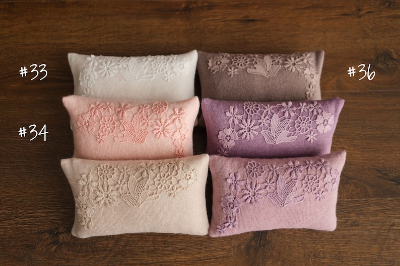 Newborn posing pillow — soft pastel shades, plush support, and essential prop for cozy, timeless baby photography