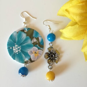 Asymmetrical floral drop earrings with steel flower pendant, brass pendant and hard stone beads