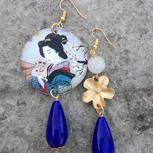 Japanese asymmetrical paper earrings with round pendant and white and blue stones