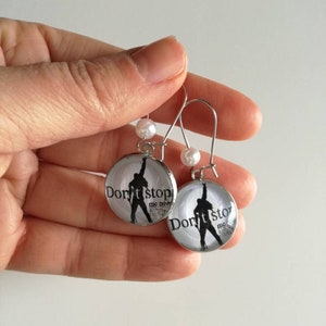 Queen drop earrings with 20mm steel cameo and image of Freddy Mercury with the phrase &quot;Don&#39;t stop me now&quot;.