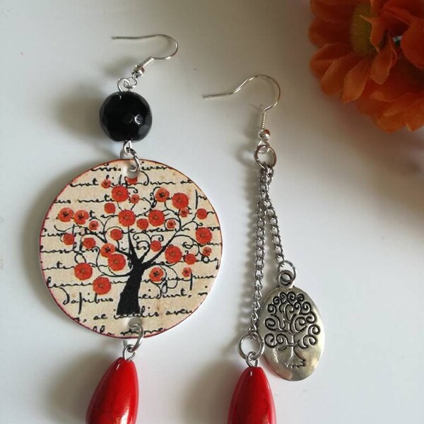 Asymmetric paper earrings with round pendant and image of red poppies and silver tree pendant of the waist