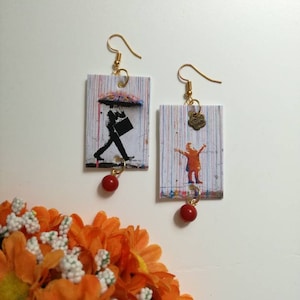 Banksy orecchini di carta pendenti con perla arancione dedicati alla street art di Banksy