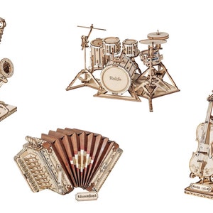 May include: A set of four wooden musical instrument models, including a saxophone, a drum set, an accordion, and a violin. The models are all made of natural wood and have intricate details.