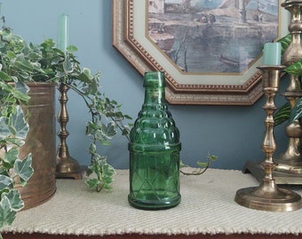 Vintage green miniture berry and banner motif glass bottle
