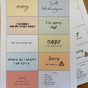 Peut inclure: Un ensemble de cartes d'excuses avec diff&eacute;rentes phrases et illustrations. Les cartes sont imprim&eacute;es sur du papier jaune, orange, rose, bleu et vert. Les phrases incluent "#sorry", "Je suis d&eacute;sol&eacute;. On peut recommencer ?", "Eh bien, regarde qui est d&eacute;sol&eacute; maintenant... Je le suis", "Je suis d&eacute;sol&eacute;. Un c&acirc;lin ?", "D&eacute;sol&eacute; (Je n'arrive pas &agrave; croire que j'ai fait &ccedil;a)", "Par o&ugrave; commencer ? Je suis d&eacute;sol&eacute;.", "D&eacute;sol&eacute; d'&ecirc;tre un...", "D&eacute;sol&eacute; pour ce que j'ai dit quand j'&eacute;tais affam&eacute;."