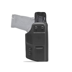 May include: A black polymer holster with a black handgun inside. The holster has a belt clip and a "G-Code" logo.