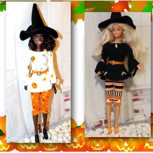 May include: Two dolls dressed in Halloween witch costumes. One doll wears a white top with orange pumpkin designs and orange pants. The other doll wears a black dress and striped orange and black leggings. Both dolls wear black witch hats.