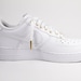 white air forces with gold nike sign