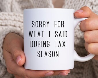 May include: White ceramic coffee mug with black text that reads "Sorry for what I said during tax season".