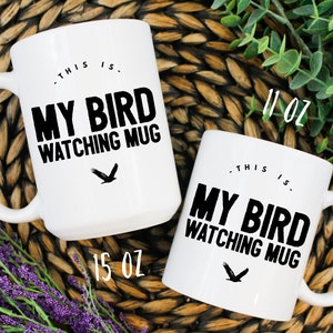 May include: Two white ceramic mugs with black text and a black bird graphic. The text on the mugs reads "This is. My Bird Watching Mug". The larger mug is 15 oz and the smaller mug is 11 oz.