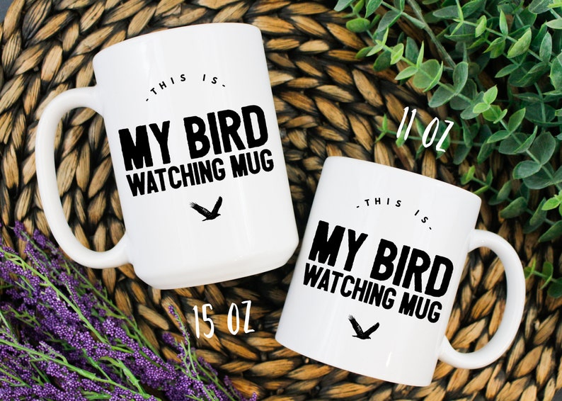 May include: Two white ceramic mugs with black text and a black bird graphic. The text on the mugs reads "This is. My Bird Watching Mug". The larger mug is 15 oz and the smaller mug is 11 oz.