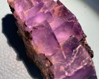 Gemmy inclusions purple fluorite in matrix