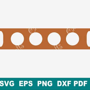 May include: A brown wooden board with five cut-out circles and two rectangular holes. The board is a template for creating a craft project.