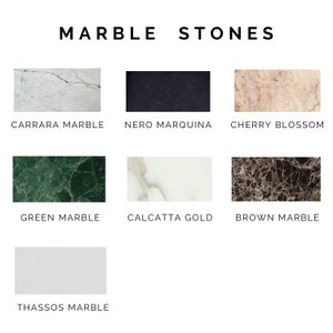 May include: A collection of marble stones in various colours and patterns, including Carrara marble, Nero Marquina, Cherry Blossom, Green Marble, Calcatta Gold, Brown Marble, and Thassos Marble.