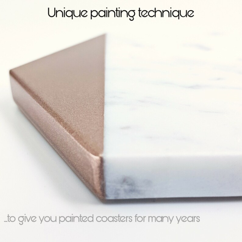 May include: Close-up of a white marble and rose gold painted coaster. The coaster has a unique painting technique to give you painted coasters for many years.