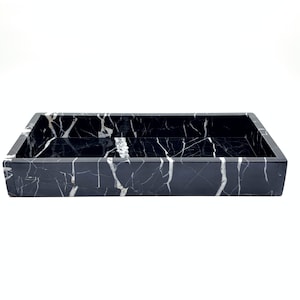 May include: Black marble rectangular tray with white veining.