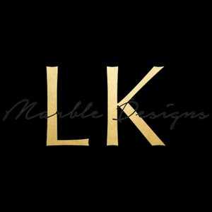 May include: Gold letters "LK" with the text "Marble Designs" in cursive script below.