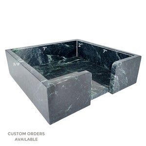 Green marble napkin holder with light veining. Dimensions are 7 inches; internal width and length, 2 inches; internal height, and 3/8 inches; thick. Text reads as Custom Orders Available.