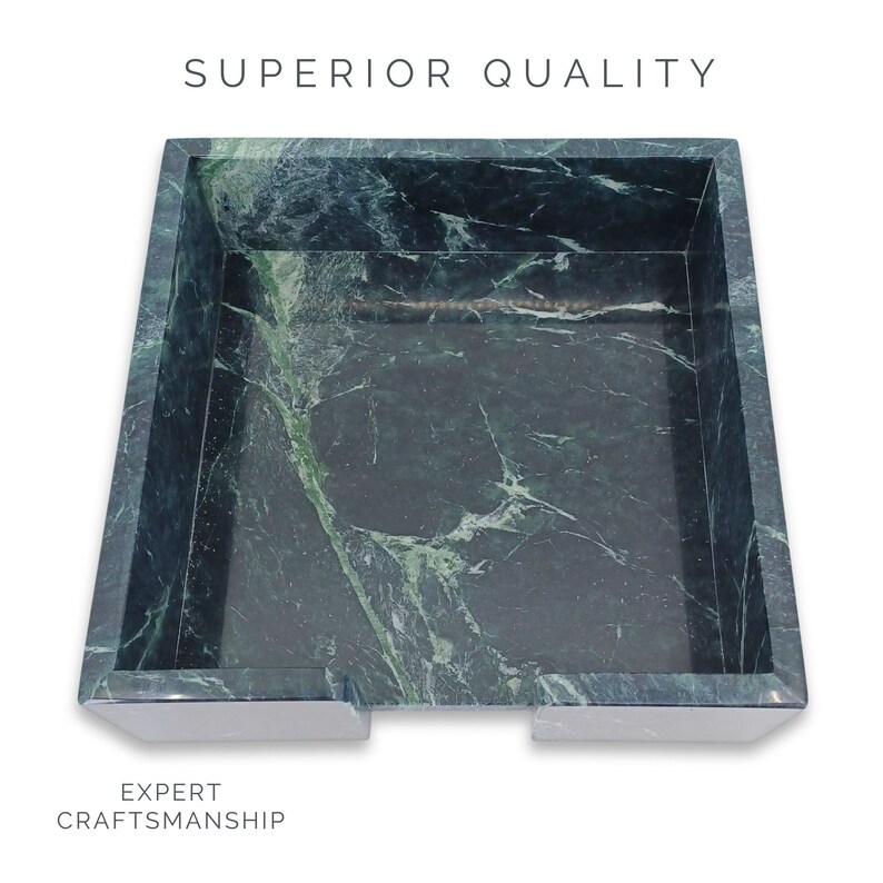 May include: A square dark green marble tray with white veining, featuring a cutout on the front edge. The text SUPERIOR QUALITY is printed above the tray, and the text EXPERT CRAFTSMANSHIP is printed below the tray on a white background.