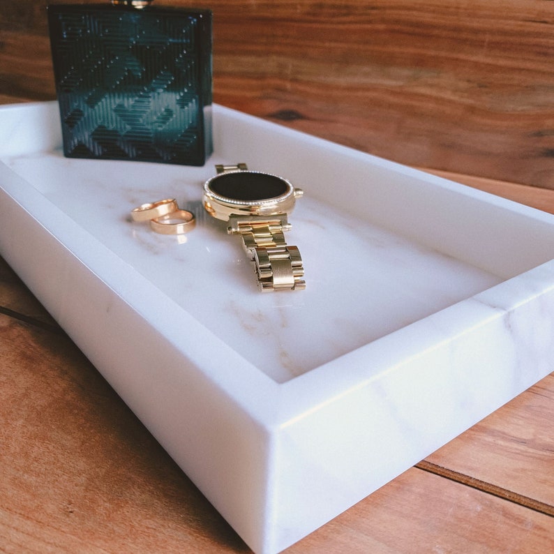 Marble vanity tray for bathroom holding watch and rings, Calacatta Gold stone, hand-polished in California.