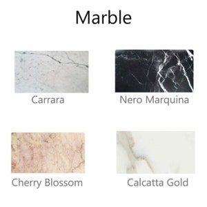 May include: Four different types of marble slabs: Carrara, Nero Marquina, Cherry Blossom, and Calcatta Gold. Each slab shows the unique veining and color patterns of the marble.