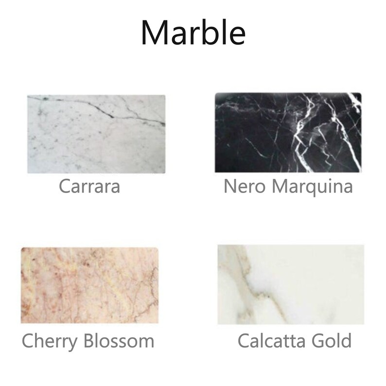 May include: Four different types of marble slabs: Carrara, Nero Marquina, Cherry Blossom, and Calcatta Gold. Each slab shows the unique veining and color patterns of the marble.