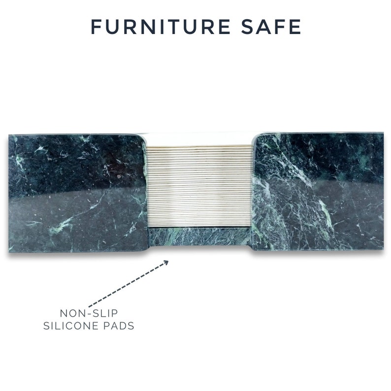 May include: A dark green marble desk accessory with a polished finish and a central stack of thin, light-colored paper sheets. The text FURNITURE SAFE appears at the top, and an arrow points to the base labeled NON-SLIP SILICONE PADS.
