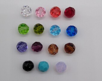 May include: Assortment of 15 faceted glass beads in various colors, including clear, pink, red, green, blue, purple, brown, black, turquoise, and lavender.