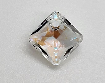 May include: A clear crystal pendant with a square shape and a small hole at the top for hanging.