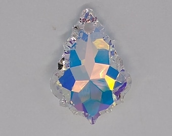 May include: A clear crystal teardrop pendant with a faceted design and iridescent rainbow colors.