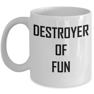 May include: White ceramic coffee mug with black text that reads "DESTROYER OF FUN".