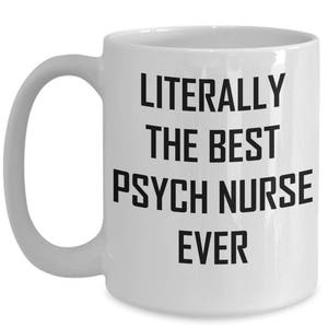 May include: White ceramic coffee mug with a black handle. The mug has black text that reads "LITERALLY THE BEST PSYCH NURSE EVER".
