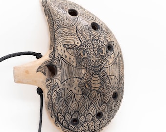 Ceramic ocarina Little Dragon. Handmade clay flute with an engraved fantasy drawing
