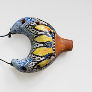Small ceramic ocarina Yellow petals. Ceramic musical pendant
