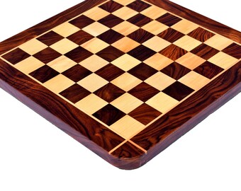 May include: A wooden chessboard with a dark brown and light wood pattern. The board has a rounded edge and a dark brown border.