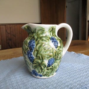 Vintage pottery picture - blue grape with green leaves pattern, marked but unidentified.  McCoy??