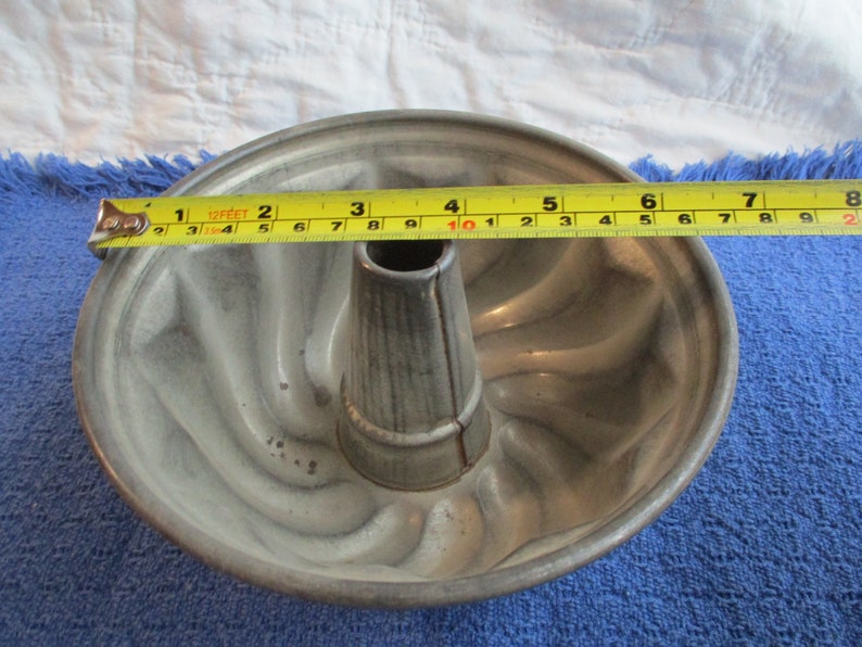Round antique tin cake or jello mold