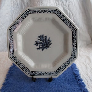 May include: A white octagonal ceramic serving platter with a blue floral design and a blue and white border.