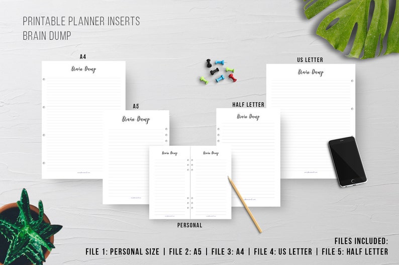 May include: A collection of printable planner inserts in various sizes, including A4, A5, US Letter, and Half Letter. Each sheet is white with lined pages and the words "Brain Dump" in a handwritten style. A smartphone and a pencil are also visible.