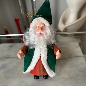 May include: A rustic wooden sign with the text "Welcome to our home" in a handwritten style. The sign features a distressed finish and a simple, inviting design, perfect for a front door or entryway.