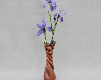 Craft ceramic vase in modern style for flowers or ekibana. Milk ceramics covered with glaze.