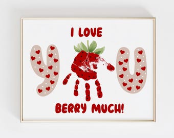 May include: Framed art print with the words "I LOVE YOU BERRY MUCH!" in red. The "O" in "LOVE" is a handprint shaped like a strawberry. The "Y" in "YOU" is made of beige shapes with red hearts.