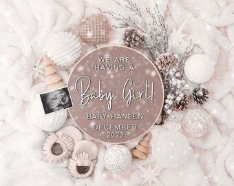 May include: A brown wooden circle with the text "We are having a Baby Girl! Baby Hansen December 2023" surrounded by white and brown ornaments, a baby ultrasound image, and baby booties on a white fluffy background.