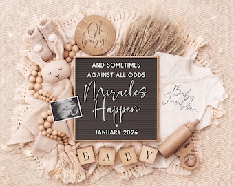 May include: A brown letter board with the text "And sometimes against all odds miracles happen" and the date "January 2024".  The letter board is surrounded by a white onesie with the text "Baby Jacobson", a wooden bunny, a wooden rattle, a wooden bottle, a wooden bead garland, and a wooden sign that says "Oh baby!"