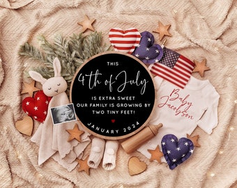 May include: A black chalkboard sign with the text "THIS 4th of July IS EXTRA SWEET OUR FAMILY IS GROWING BY TWO TINY FEET! JANUARY 2024" surrounded by red, white, and blue hearts, stars, and a baby onesie with the text "Baby Jacobson" in red.