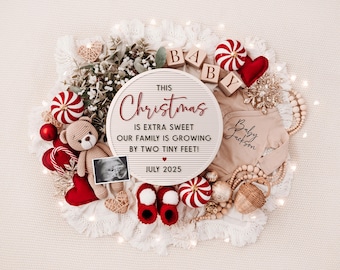 May include: A white letter board with the text "This Christmas is extra sweet our family is growing by two tiny feet! July 2025" surrounded by red and white candy canes, a red heart, a teddy bear, a baby onesie, and a sonogram image.