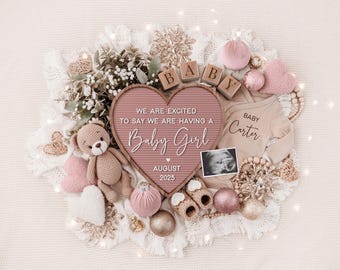 May include: A pink heart-shaped letter board with the text "We are excited to say we are having a Baby Girl August 2025". The board is surrounded by a variety of baby-themed items, including a teddy bear, a baby onesie, and wooden blocks that spell out "BABY".