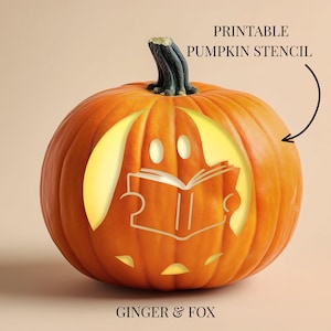 May include: An orange pumpkin with a dark green stem featuring a carved design of a ghost reading a book. The pumpkin is illuminated from within. Text on the image reads PRINTABLE PUMPKIN STENCIL and GINGER & FOX, with an arrow pointing to the pumpkin.